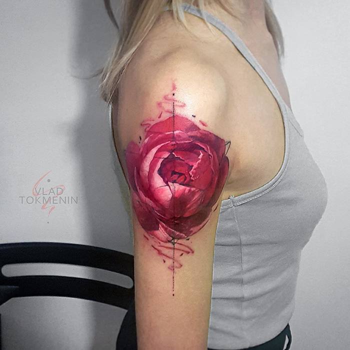 Pink peony tattoo on the right upper arm by Vlad Tokmenin