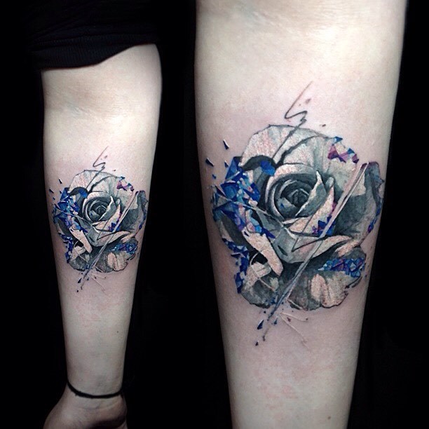 Graphic style rose tattoo on the left inner forearm Vlad Tokmenin