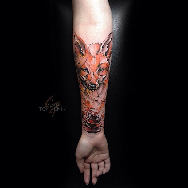 Sketch work style fox and rose tattoo on the right inner forearm by Vlad Tokmenin