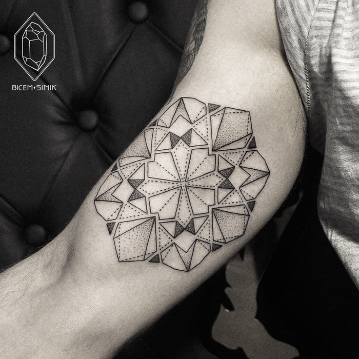 Geometric mandala tattoo on bicep by Bicem Sinik