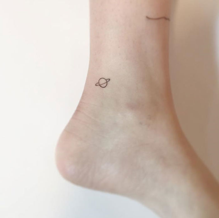 Minimalist Planet Tattoo on Ankle By Playground Tattoo