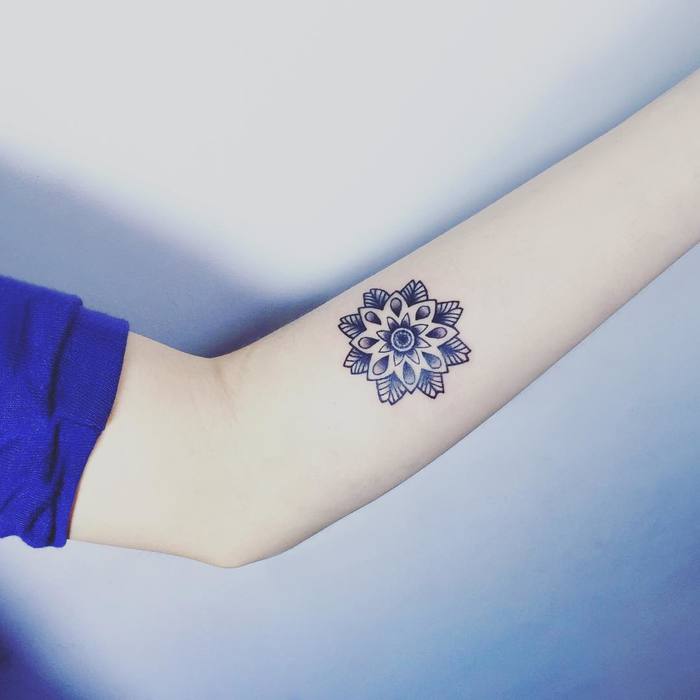 Inner forearm mandala tattoo by Tattooist IDA