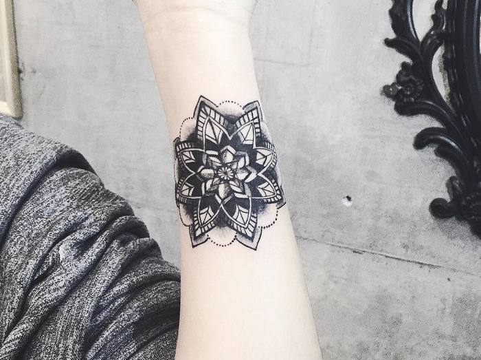 Inner forearm mandala tattoo by Laura Martinez