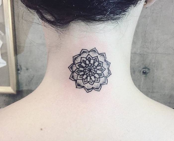 Mandala tattoo on back of neck by Laura Martinez