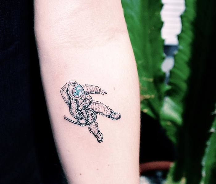 Tiny Astronaut Tattoo by Raphael Lopes