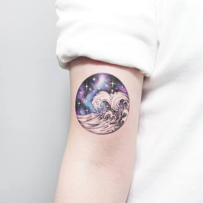 Cosmic wave tattoo by Tattooist Ida