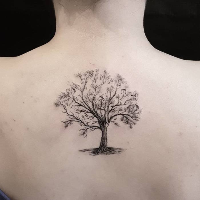 Upper Back Tree Tattoo with Musical Notes by Otavio Borges