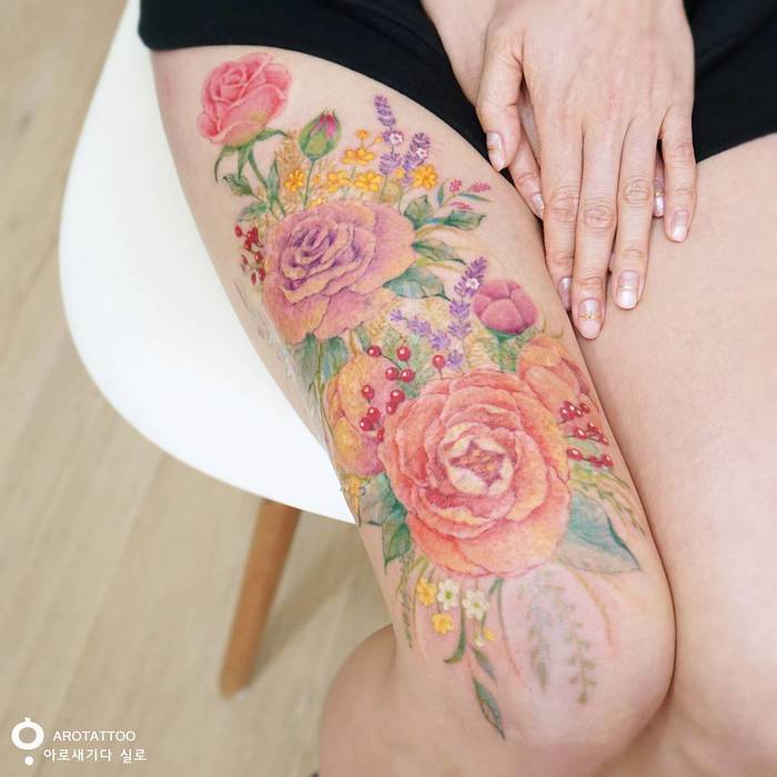 Vibrant Floral Tattoo by Tattooist Silo