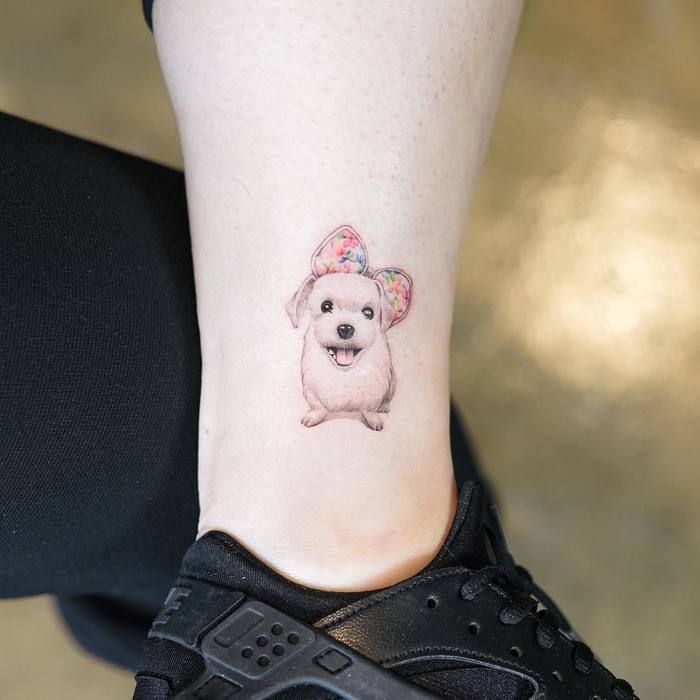 Small Puppy Tattoo by Nando Tattoo