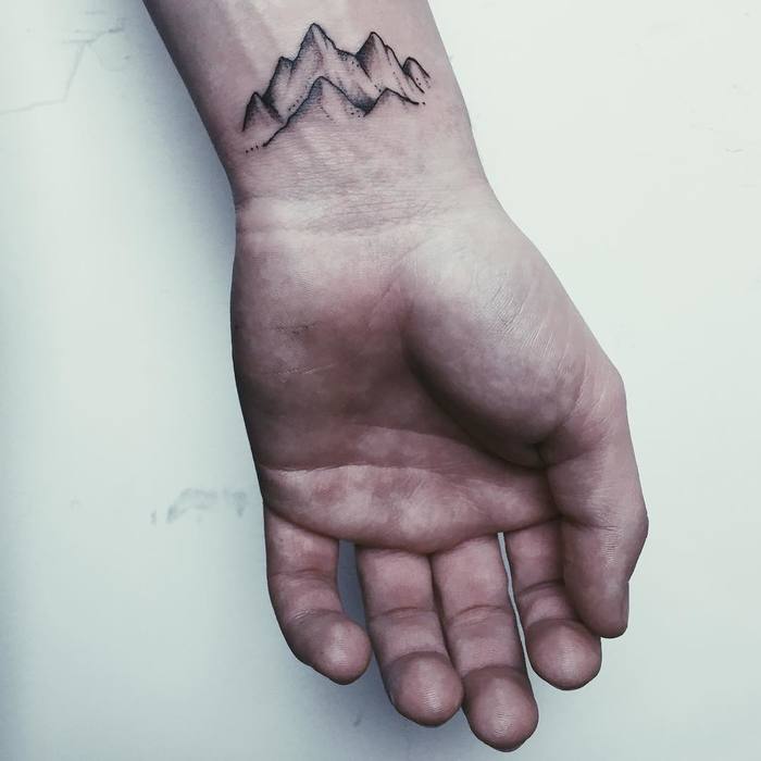 Small Mountain Tattoo on Wrist by Anna Maria Reh