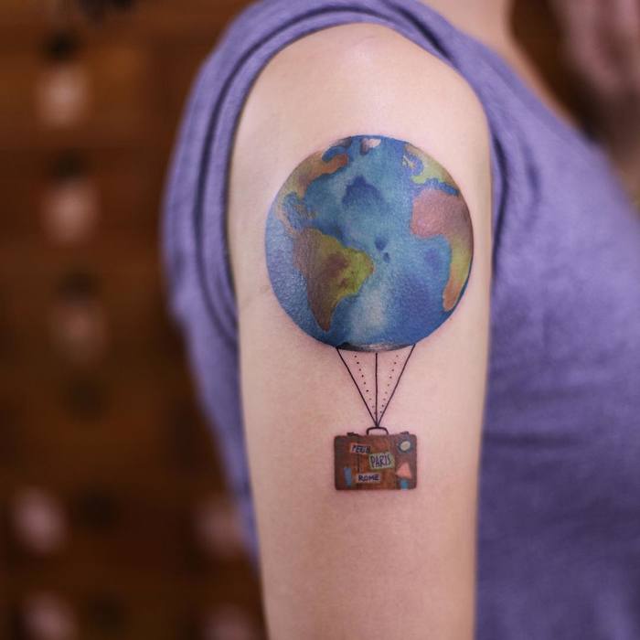Colored Earth Tattoo on Arm by newtattoo_qiqi