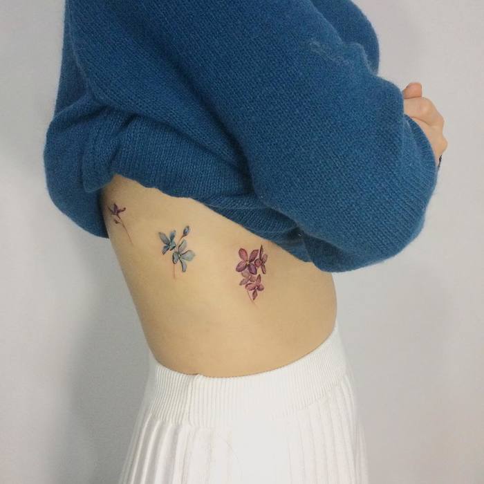 Lilac Flowers on Ribs by tattooist_doy