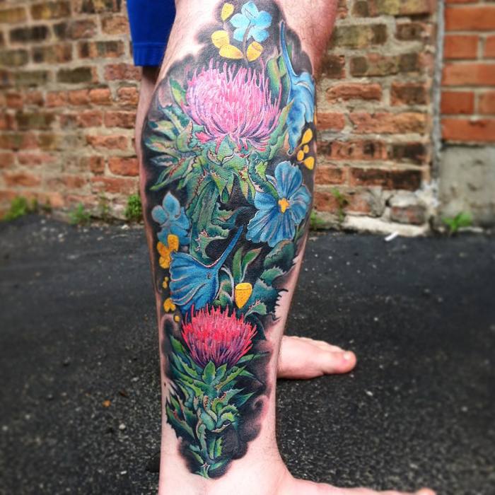 Thistle Plants and Morning Glory Flowers on Calf by suhoustontattoos