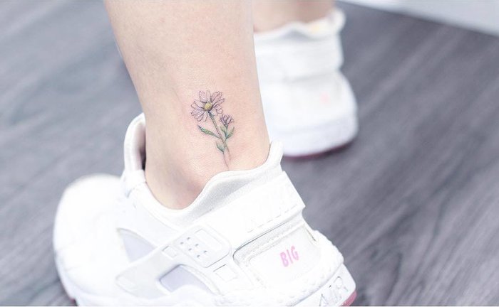 Subtle Daisy Tattoo on Ankle
