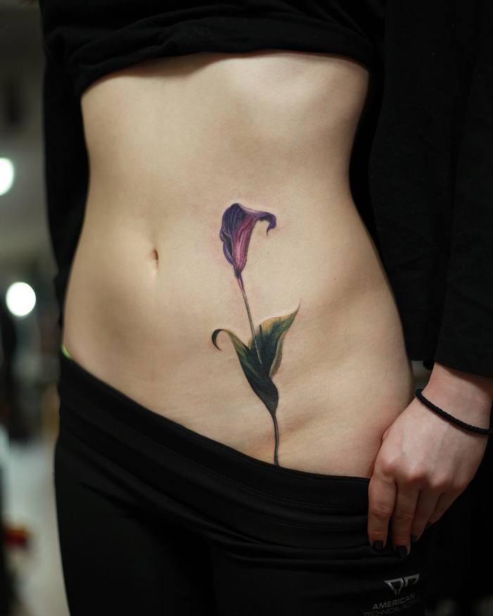 Realistic Calla Tattoo on Belly by woori_tattoo