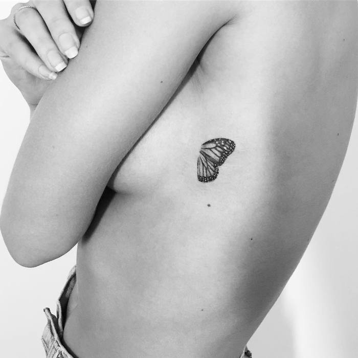 Tiny Butterfly Wings on Ribs by evantattoo