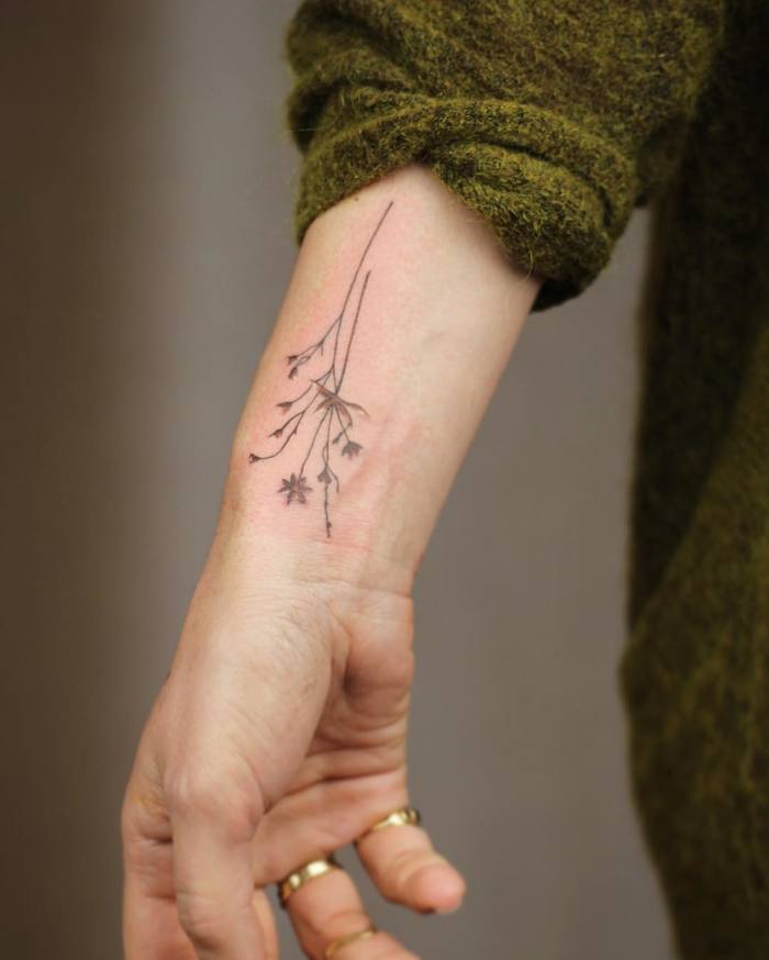 Dried Flowers Tattoo on Wrist by Cindy van Schie