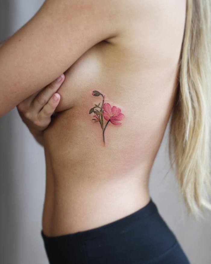 Stylish Geranium Flower Tattoo on Ribcage by Cindy van Schie