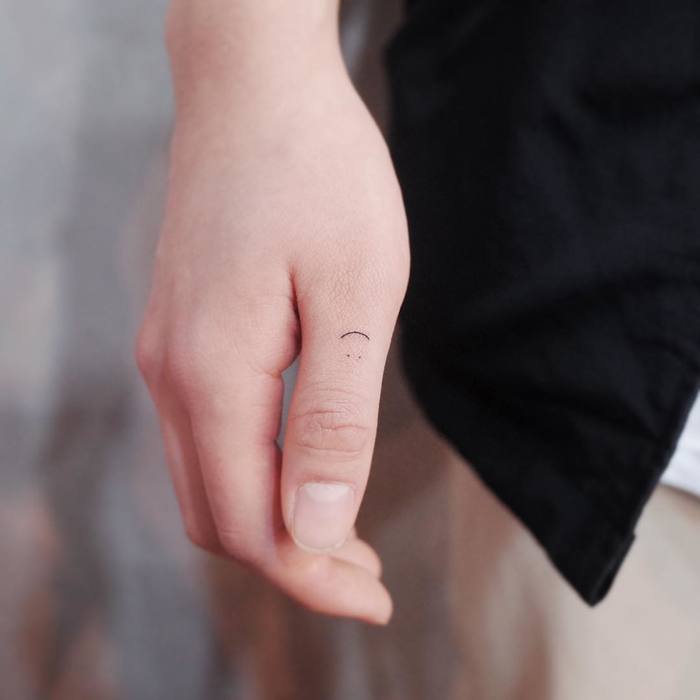 Ultra Minimalist Smiley Tattoo on Finger by Witty Button
