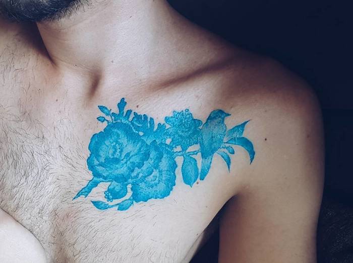 Blue Ink Tattoo On Chest