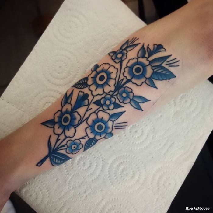 Blue Ink Flower Tattoo by Koa Tattoo