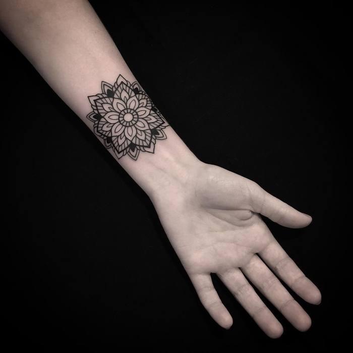 Mandala tattoo on wrist by Luciano LCN