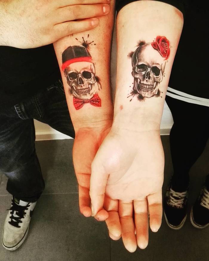 Matching Skull Tattoos by Achan 