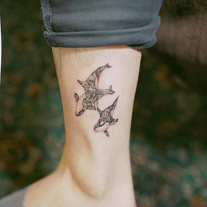 Floral Orcas on Ankle by nandotattooer