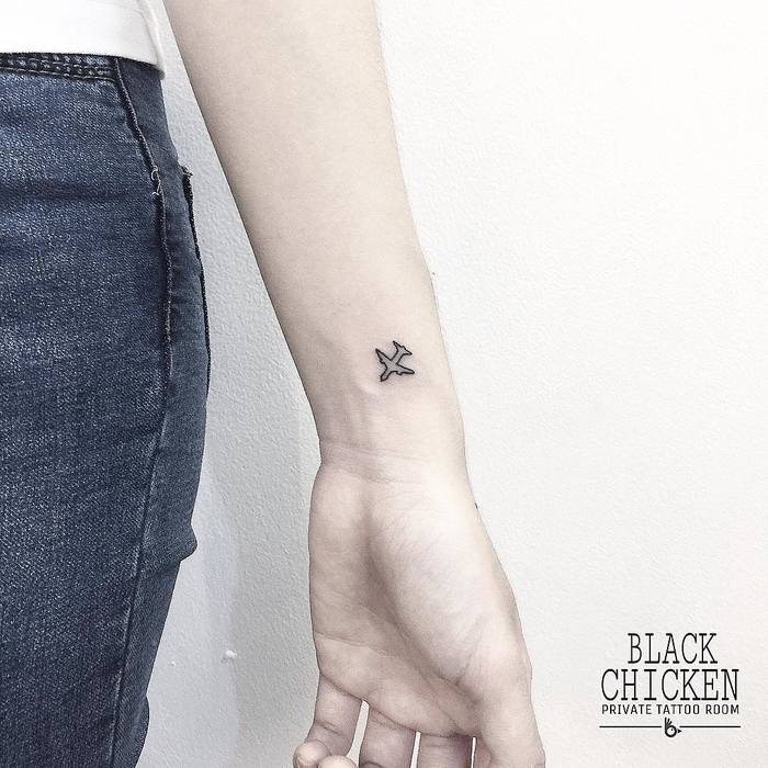 Tiny Airplane Tattoo by tattooist.blackchic